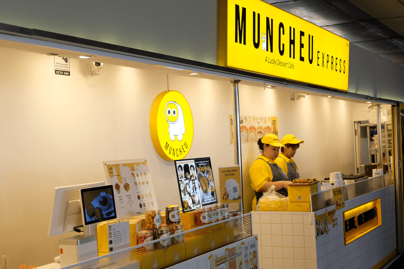 Staff in yellow at the MUNCHEU shop counter